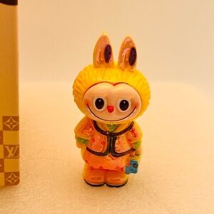 Yellow Bunny Figurine with Multicolor Outfit
